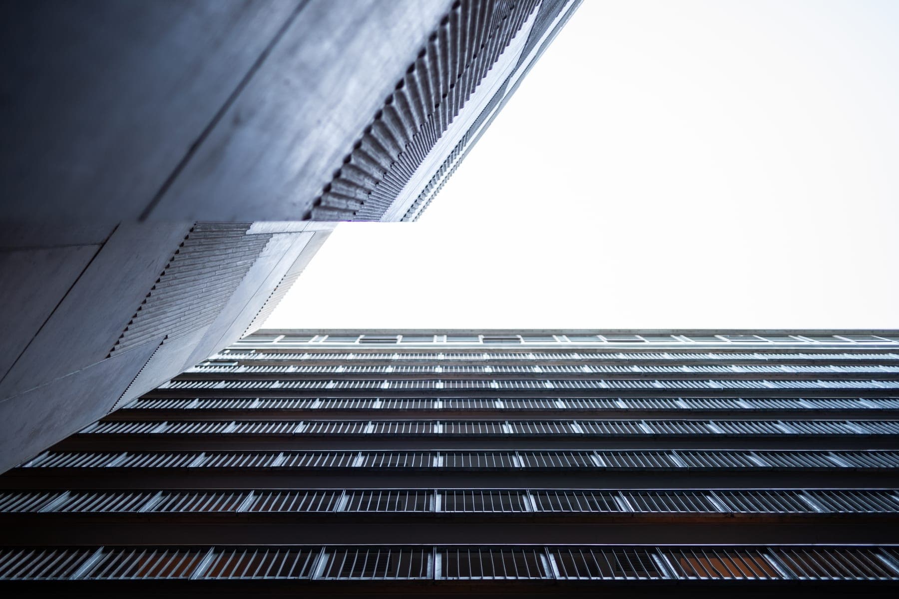 A high-rise building seen from the street below